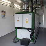 Eines der Blockheizkraftwerke, die in Haßfurt für energieeffizienten Grundlaststrom und günstige Tarife sorgen. Foto: Urbansky